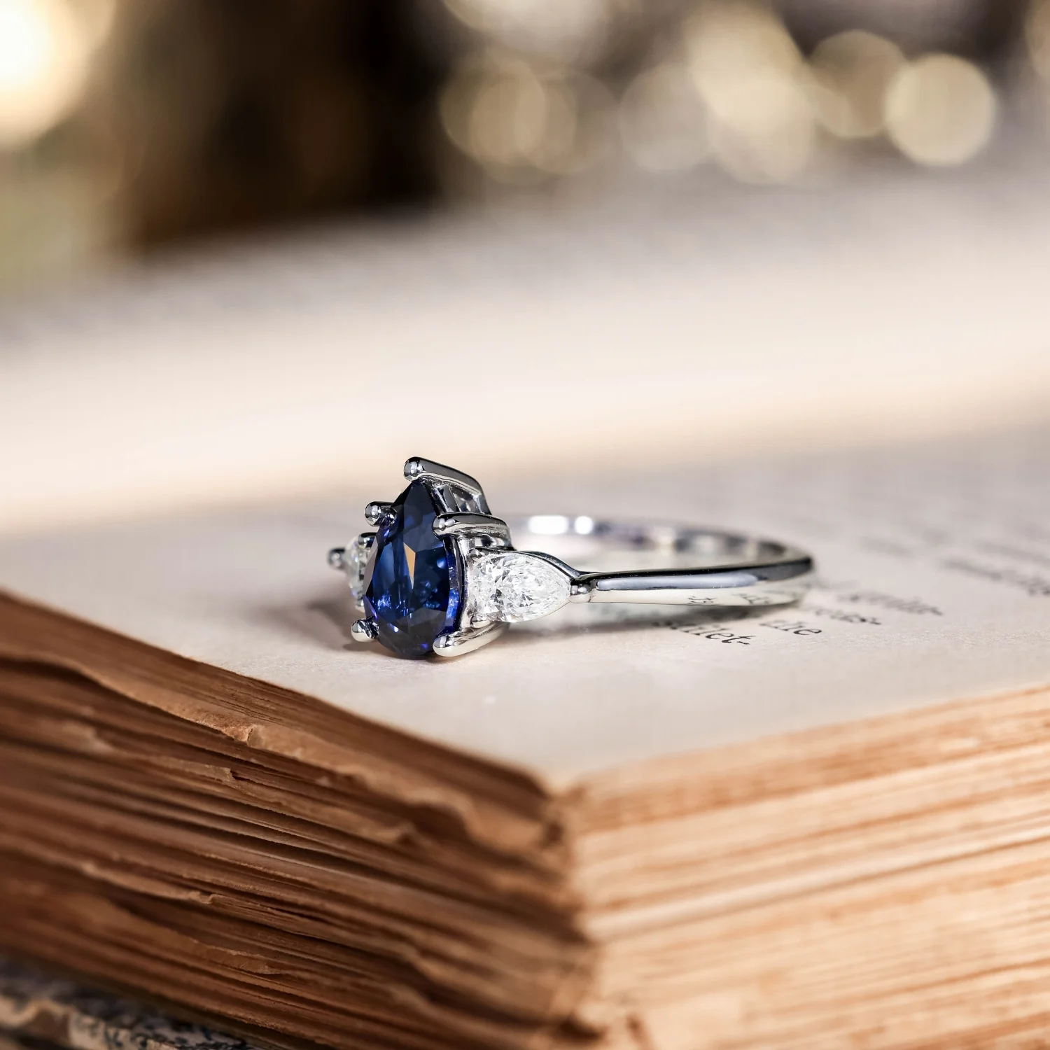 The Diana - Blue Sapphire Pear Cut Three Stone Engagement Ring with Diamond Accents - Image 8